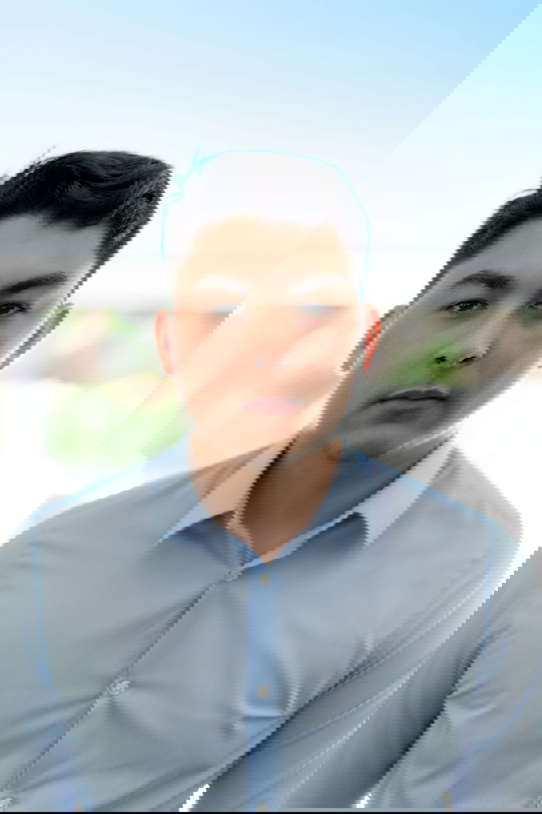 man in blue dress shirt